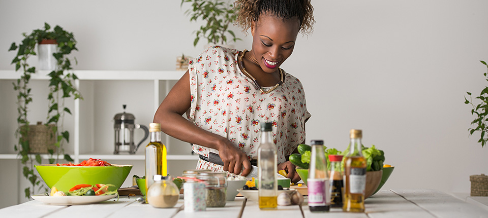Young African Woman Cooking. Healthy Food - Vegetable Salad. Diet. Dieting Concept. Healthy Lifestyle. Cooking At Home. Prepare Food; Shutterstock ID 250750663; PO: 123